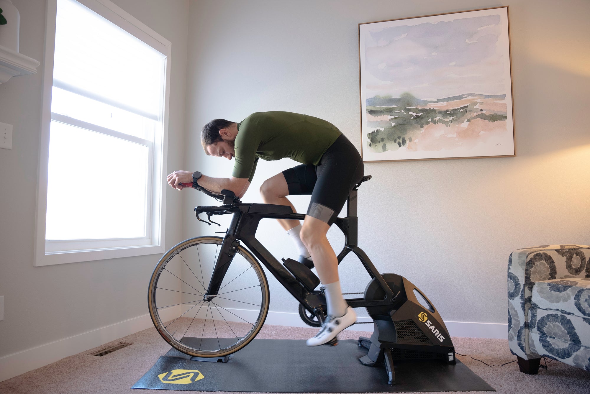 man riding bike on saris h3 plus direct drive smart indoor bike trainer