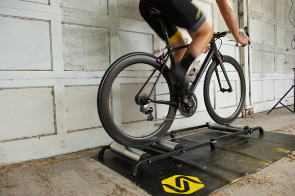 Rider warming up on Saris 9501T Cycling Rollers — pre-race indoor session