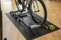 Cyclist sprinting on Saris 9501T Cycling Rollers — high-cadence roller training