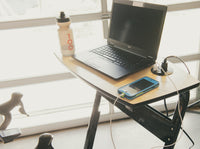 Saris TD1 Trainer Desk positioned over handlebars — tray adjustment detail
