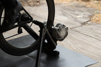 Rider in race kit training hard on the Saris Fluid 2 Smart Trainer