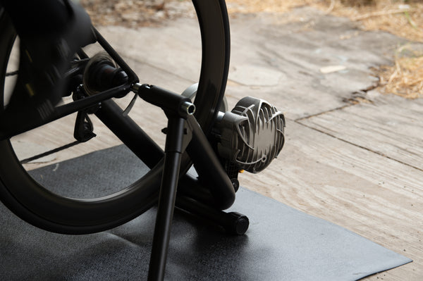 Rider in race kit training hard on the Saris Fluid 2 Smart Trainer