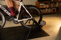 Cyclist on the Saris Fluid 2 Smart Trainer — early morning home training session