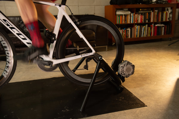 Cyclist on the Saris Fluid 2 Smart Trainer — early morning home training session