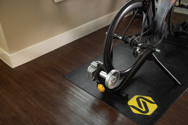 Rider cooling down on the Saris Fluid 2 Smart Trainer after a workout