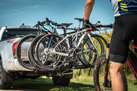 Saris Freedom 4-Bike Hitch Rack carrying four bikes on highway road trip