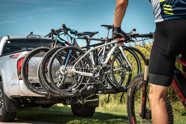 Saris Freedom 4-Bike Hitch Rack carrying four bikes on highway road trip
