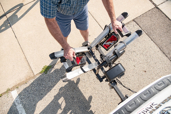 Loading a bike onto the Saris Door County Motorized Hitch Rack