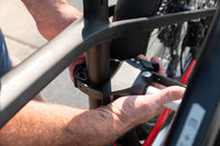 Saris Door County Hitch Rack — ratcheting wheel strap securing bike tire