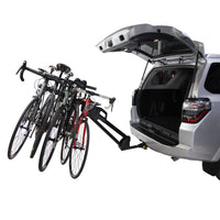 Saris Glide EX 5-Bike Platform Hitch Rack — bikes loaded, rear hatch open beneath