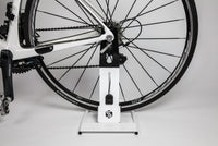 Saris Boss Rear Wheel Bike Stand — with road bike stored upright in jaw grip