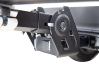 Saris MHS base unit tilted away from vehicle — one-hand tilt operation for hatch access
