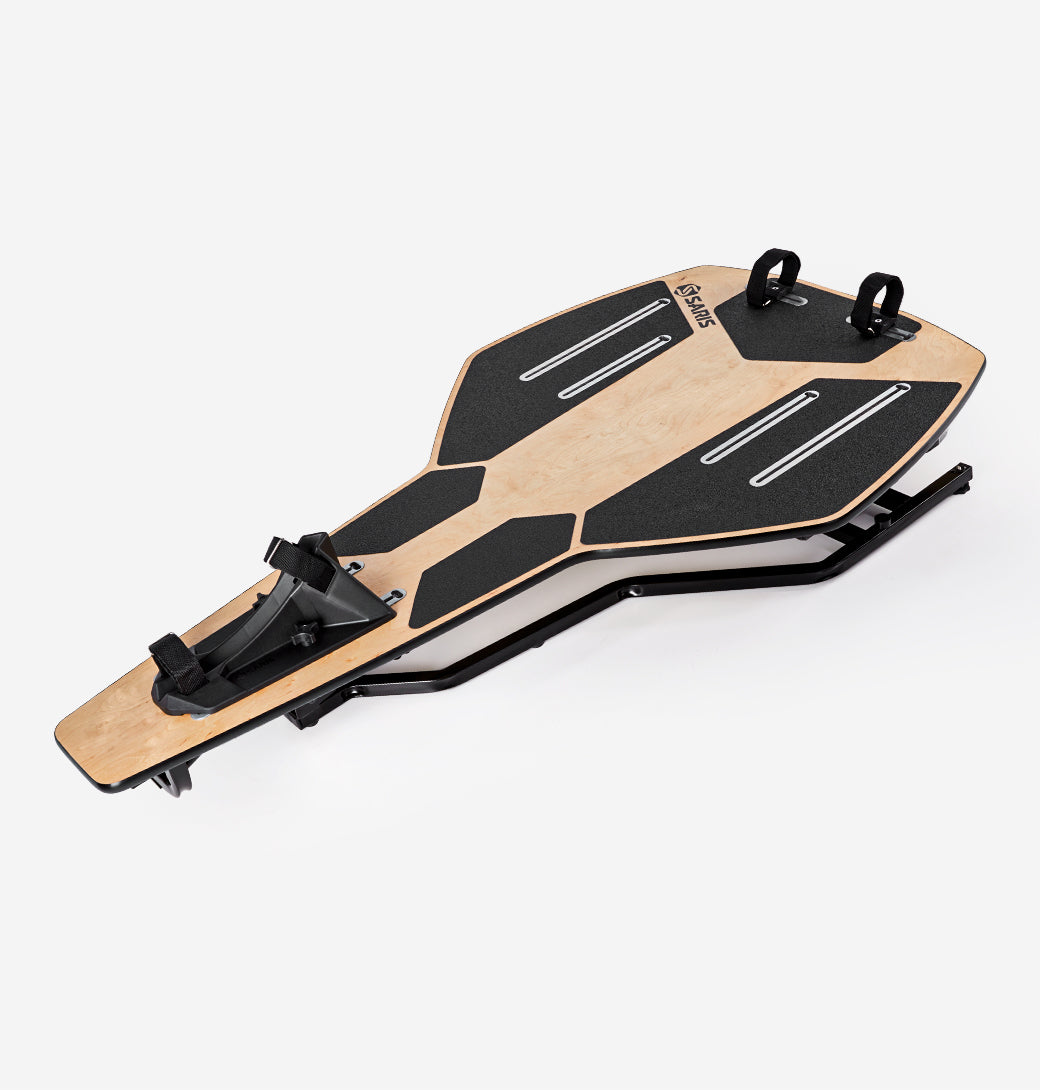 Saris MP1 Nfinity Motion Platform — rocker deck tilted right, simulating natural bike lean