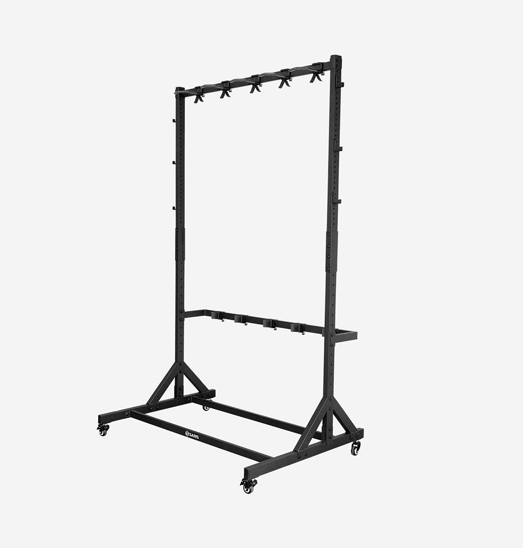 A black rolling 5-bike storage rack holding several bicycles, shown next to its retail box on a white background. The box is branded SARIS and reads 'ROLLING 5-BIKE STORAGE RACK' and 'SECURE FREESTANDING VERTICAL ORGANIZER'.