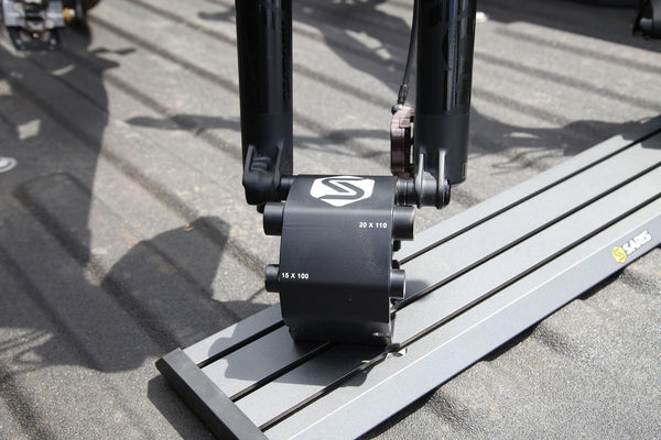 Saris Traps fork-mount carriers in truck bed — bikes locked in for road trip