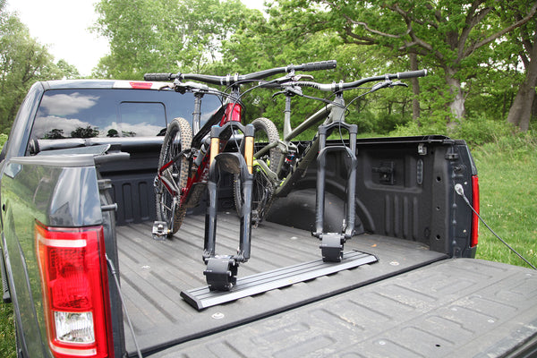 Saris Traps thru-axle fork-mount carrier — bike loaded, heading to trailhead