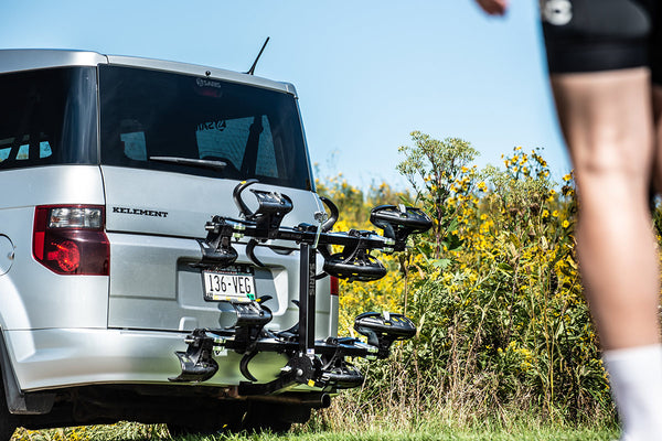 Saris SuperClamp G3 4-Bike Hitch Rack tilted for rear hatch access